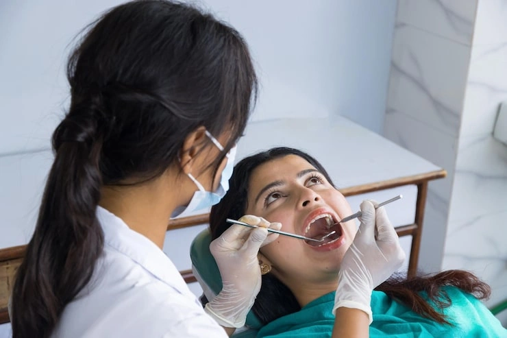 asian dentist checking up her patient female dentist female patient hospital 723123 1859