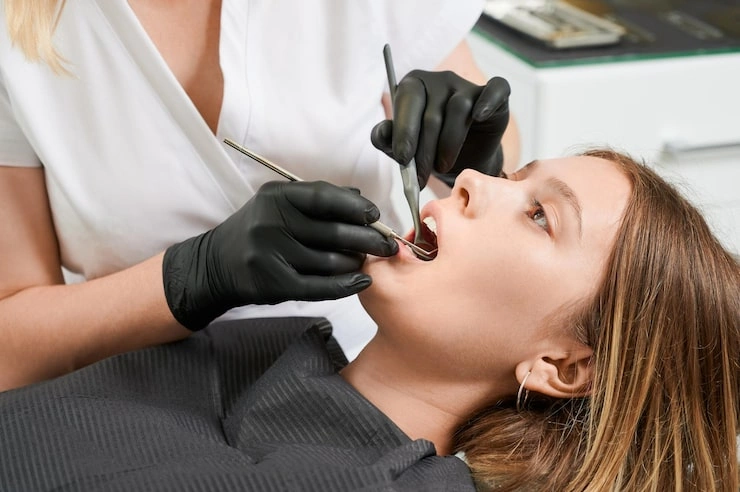 female doctor examining patient teeth dental clinic 651396 3116
