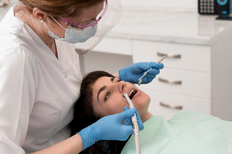 female patient having procedure done dentist 23 2148985797