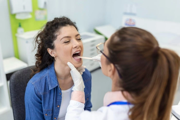 female patient opening her mouth doctor look her throat otolaryngologist examines sore throat patient 657921 181