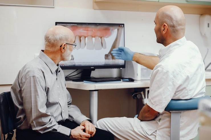 old man sitting dentist s office 1157 19443