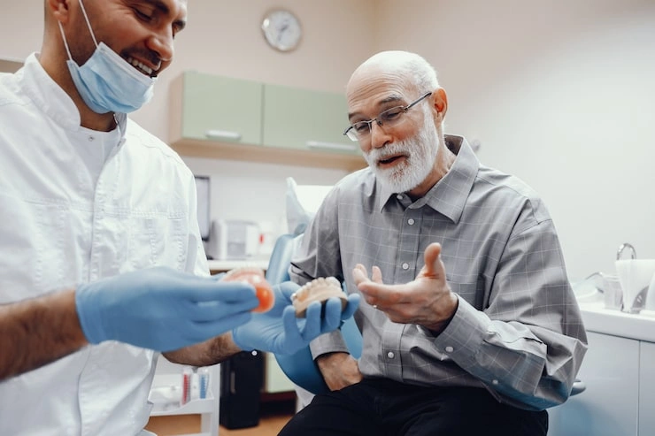 old man sitting dentist s office 1157 19450