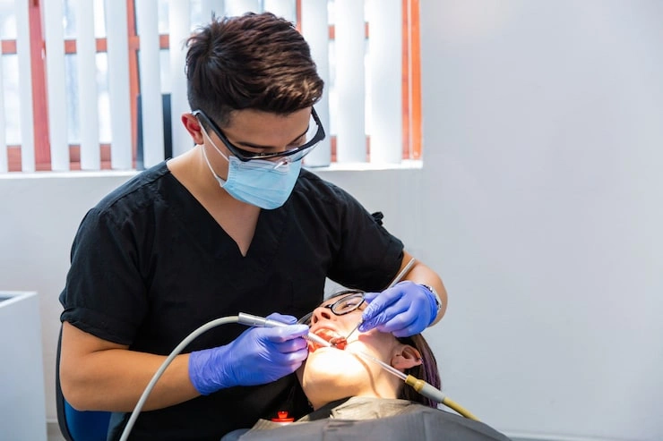 young brunette woman sitting dentists chair he is checking her teeth regular dental examination 391548 14