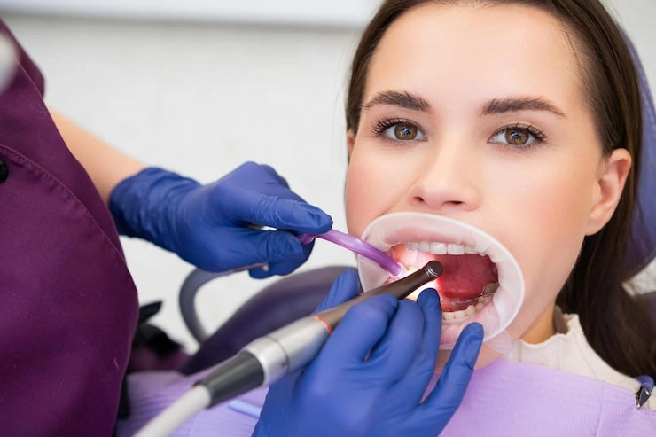 young woman receiving caries treatment dentist clinic 177415 4408